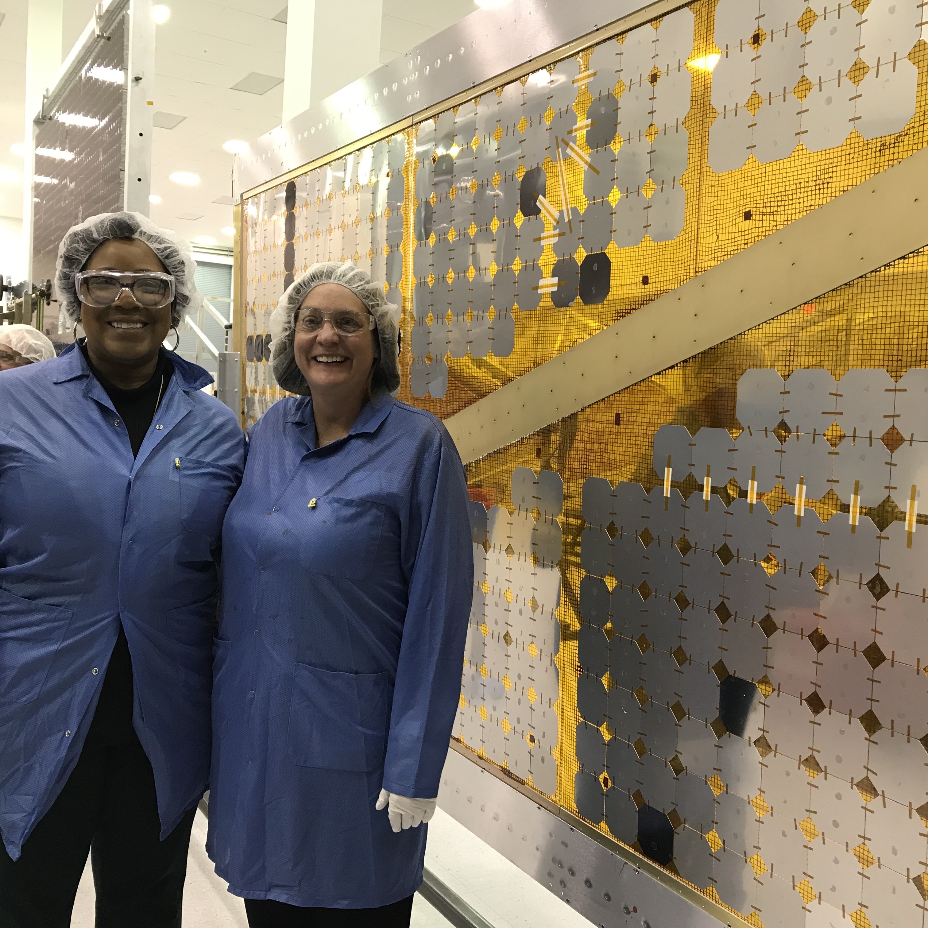 Lucy Project Manager, Donya Douglas-Bradshaw (left), and Deputy PI, Cathy Olkin (right), viewing the pathfinder for the solar array at the manufacturing readiness review in SolAero in Albuquerque, New Mexico.