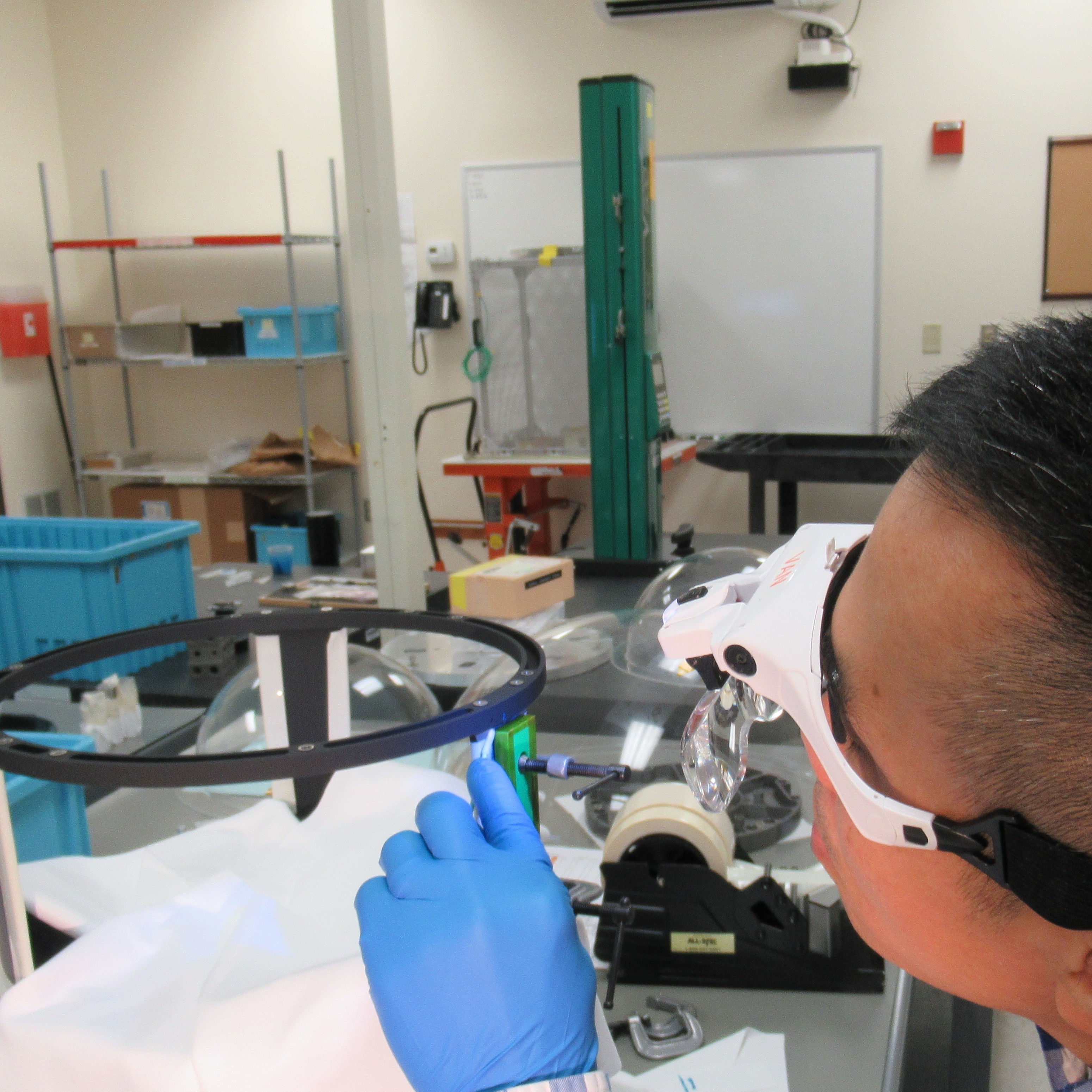 Van Phan, of L3 Harris SSG, attaching heaters to the optical telescope assembly bulkhead.