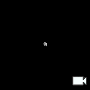 A series of images of Dinkinesh, a diamond-shaped asteroid in the center of the image and far away from the camera, and its satellite Selam, a smaller asteroid, passing behind Dinkinesh from left to right.